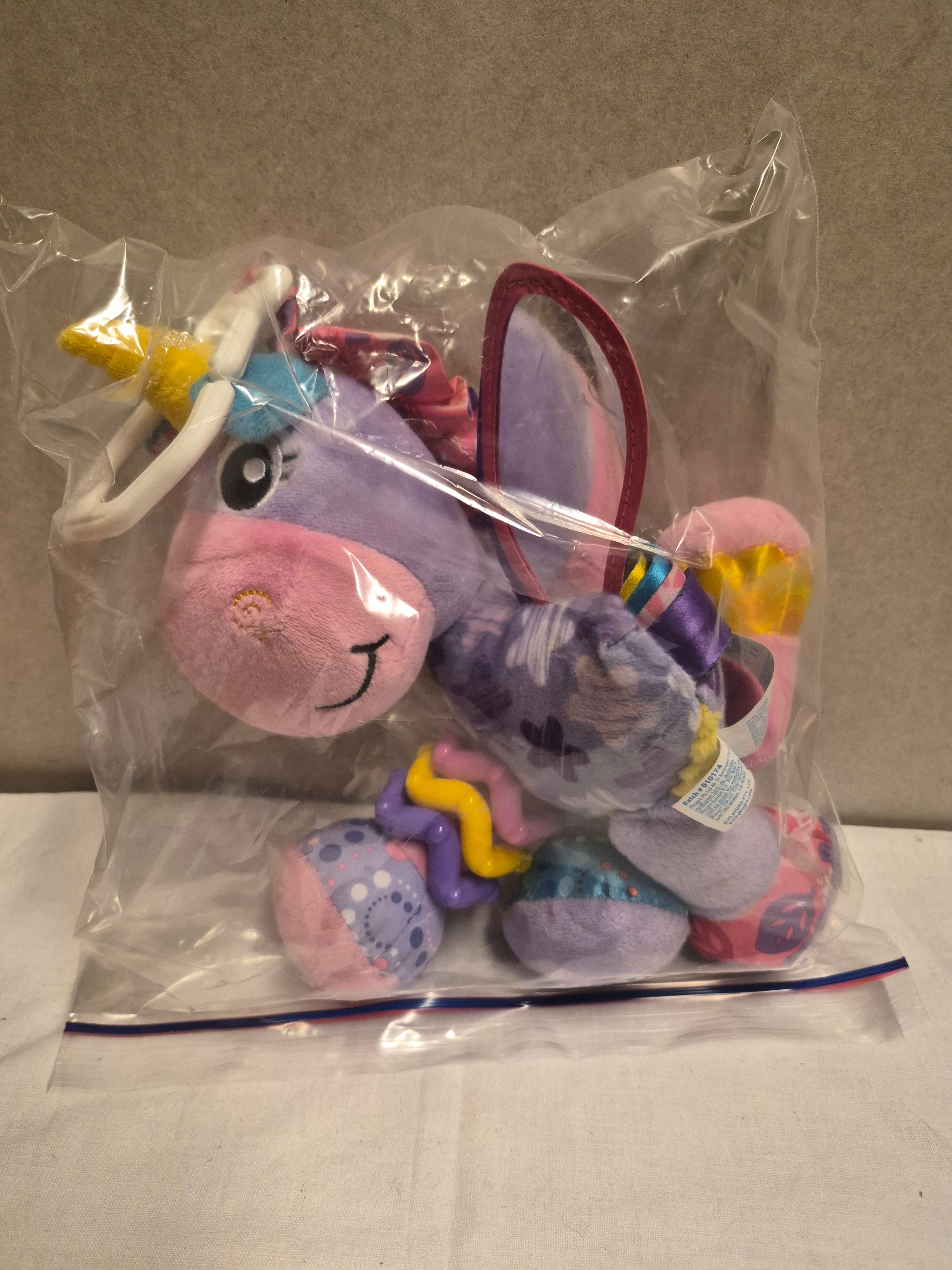 Baby activiteitenspeeltje met rammel en bijtring pony